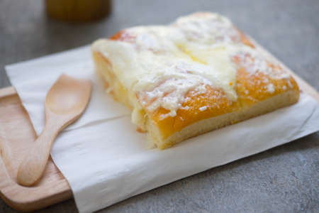 Homemade sweet buns with butter and sugar on wood tray