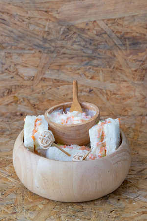 Lunch of sandwiches with coleslaw fillings on wood bowlの写真素材