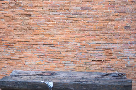 Red clay brick and stone wall with old wooden floorの写真素材