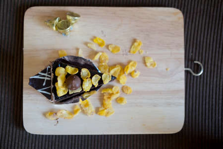 Sweet brownie chocolate cream cake topped with corn flakeの写真素材