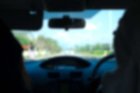 Blurred background from inside car natural light streetの写真素材
