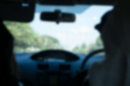 Blurred background from inside car natural light streetの写真素材