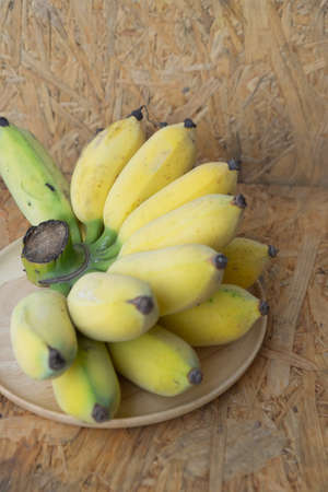 Close up yellow banana on wood trayの写真素材