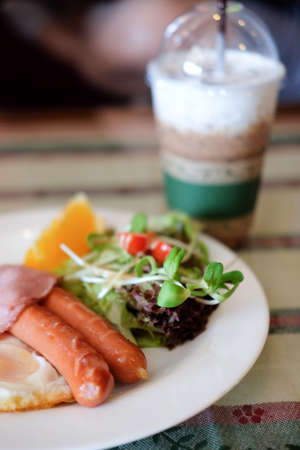 Fried egg, bacon and fresh orange. Low carb high fat breakfastの写真素材