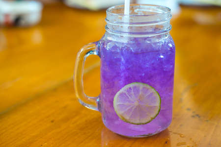 Butterfly pea and lime Juice on wood tableの写真素材