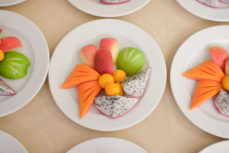 Mixed of fruit - apple, dragon fruit, papaya and  monkey apple. The food is healthy vegetarianの写真素材
