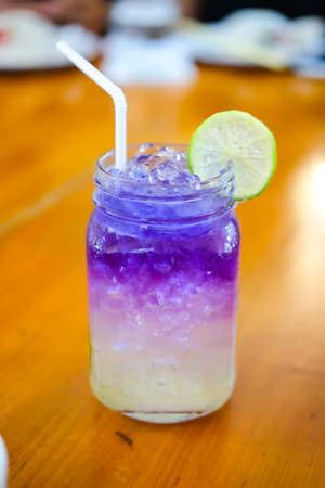 Iced butterfly pea flower blue tea with lemon, Thai herbal drink for healthy Lifeの写真素材