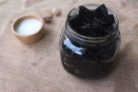 Grass Jelly with fresh milk is delicious (focus grass jelly)の写真素材