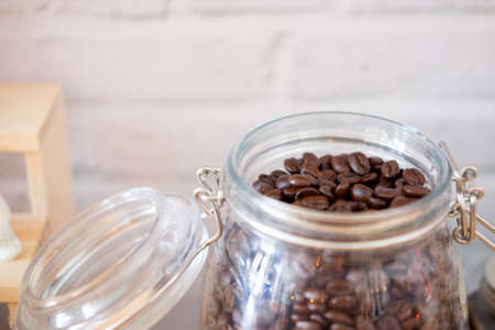Fresh coffee beans In glass jar. Open glass jarの写真素材