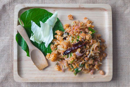 Yam Naem Khao Thot, Thai style food on wood trayの写真素材
