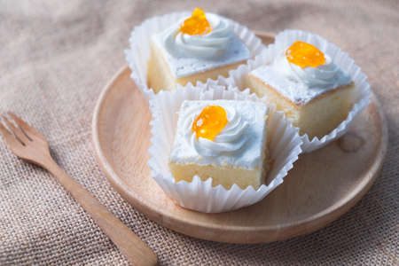 Freshly baked vanilla cakes with buttercream, top view. Dessert for the holidaysの写真素材