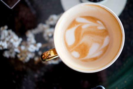 Hot fresh coffee in white cup, espresso coffee top viewの写真素材