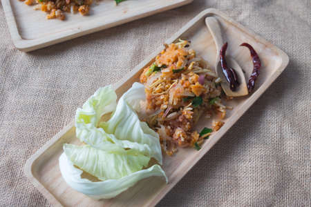 Spicy salad of curried rice croquettes. Thai style food