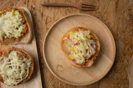 Homemade mini pizza buns topped with mayonnaise sauce