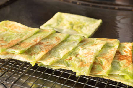 Sweet green Roti  in hot pan, sweet and crispy.