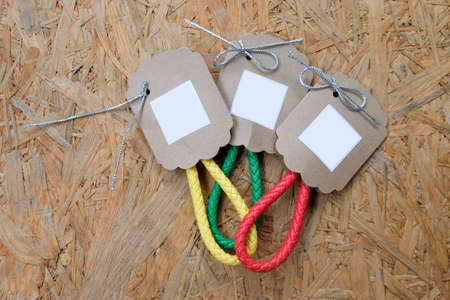 Wedding gift for guest, Key ring leather with paper tag on wooden backgroundの写真素材