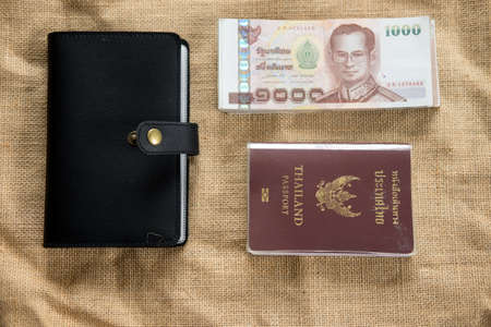 Traveling items: Thailand passport, wallet and Thai money. Travel concept flat layの写真素材