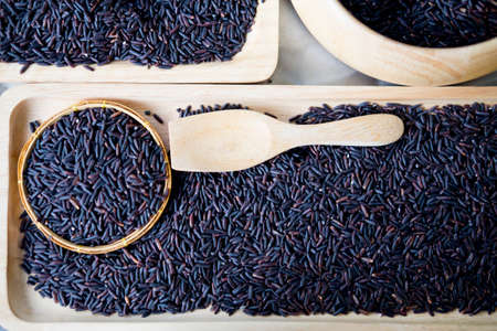 Black jasmine rice or organic riceberry rice, ready for cookの写真素材