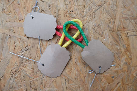 Wedding gift for guest, Key ring leather with paper tag on wooden backgroundの写真素材