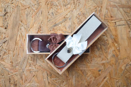 wedding gift for guest, Key ring leather in box on wood background