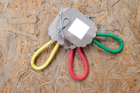 Wedding gift for guest, Key ring leather with paper tag on wooden backgroundの写真素材