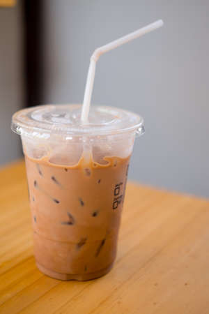 Iced Mocha Coffee in glass on the wood tableの写真素材