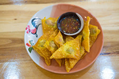 Deep fried crispy dumpling strips on plate, Thai snack foodの写真素材