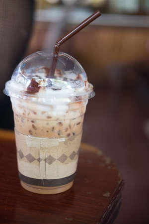 Iced mocha with milk micro foam in coffee shopの写真素材