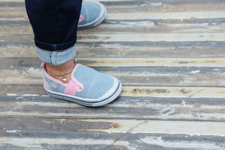 Little girl fashionista in blue shoesの写真素材