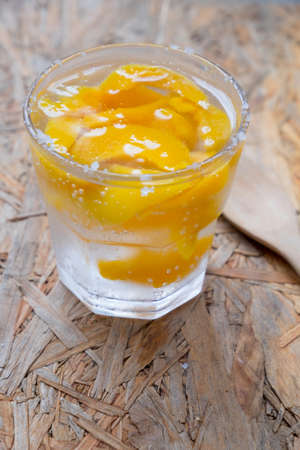 Peach soda cold summer in mini glass, homemade summer drinkの写真素材