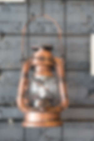 Blur background old vintage storm lanterns decoration on wallの写真素材