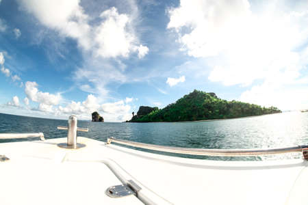 Sea and karst mountains covered with green bushes and trees, landscape of Krabi Province in Thailand. view from speed boatの写真素材