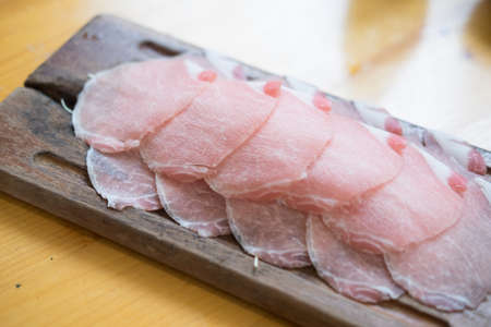 Slide raw pork meat for cooking or shabuの写真素材
