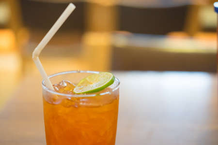 lemon ice tea glass of healthy drink water on wood tableの写真素材