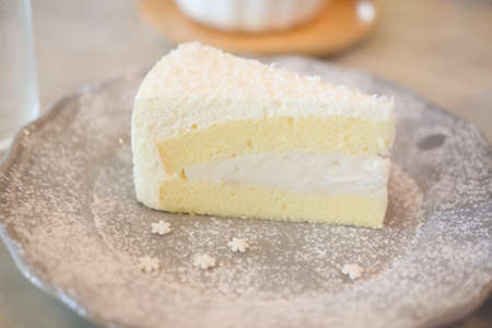 Closeup homemade sweet dessert fresh coconut cream cake, selective focusの写真素材