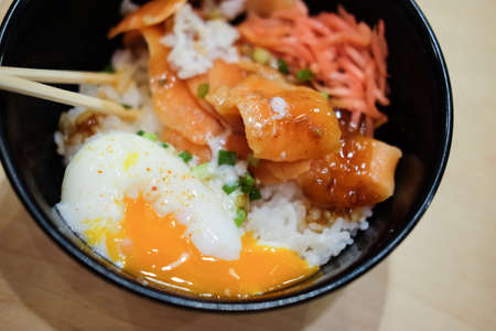 Japanese food rice bowl with raw salmon  and onsen eggの写真素材