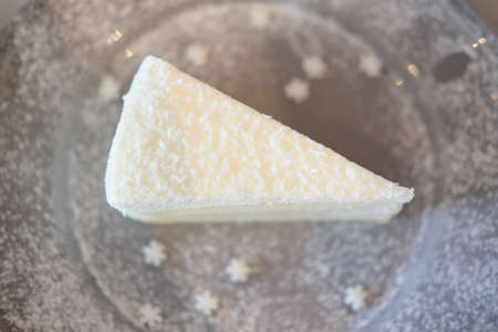 Closeup homemade sweet dessert fresh coconut cream cake, selective focusの写真素材