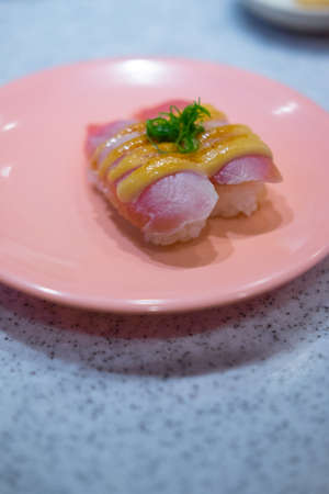 Tuna sushi - rice with fresh tuna on dish. Japanese food (soft focus)の写真素材