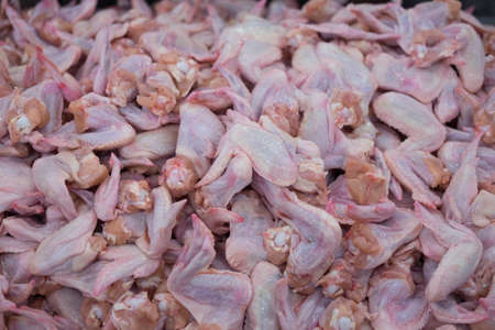 Raw chicken wings sold in the market. Selective focus.の写真素材