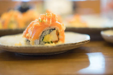 salmon sushi rolls on white dish (Salmon Sushi). selective focus.
