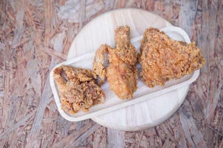 fried chicken meal on wood dish, top viewの写真素材