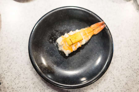Close up of Ebi sushi with shrimp on a black diahの写真素材