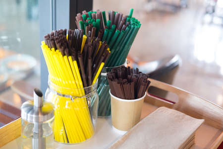 Stock straw in coffee shop, brown, green and yellowの写真素材