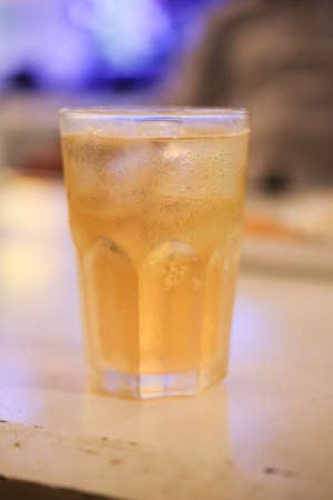 Close up glass of beer on the table in pubの写真素材