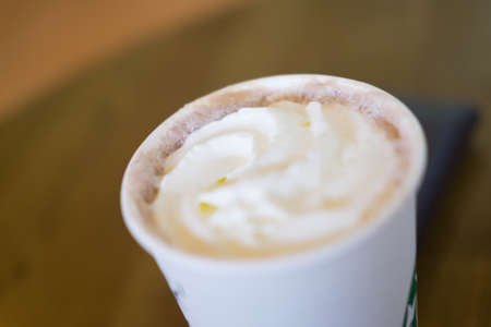 Hot coffee with wipped cream, top viewの写真素材