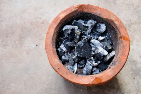 Old charcoal stove with charcoal ignited Prepare for cookingの写真素材