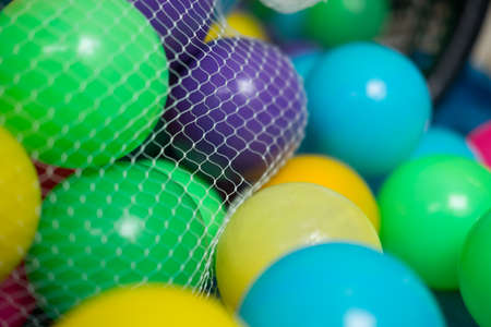Plastic colored balls for a playing in bagの写真素材