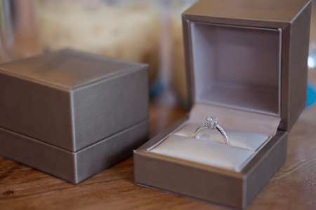 close up of gift box with diamond engagement ringの写真素材