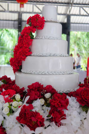 Big white wedding cake in wedding ceremonyの写真素材