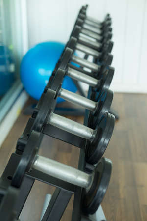 Dumbbell in fitness and gym room. Sport relax and healthy life